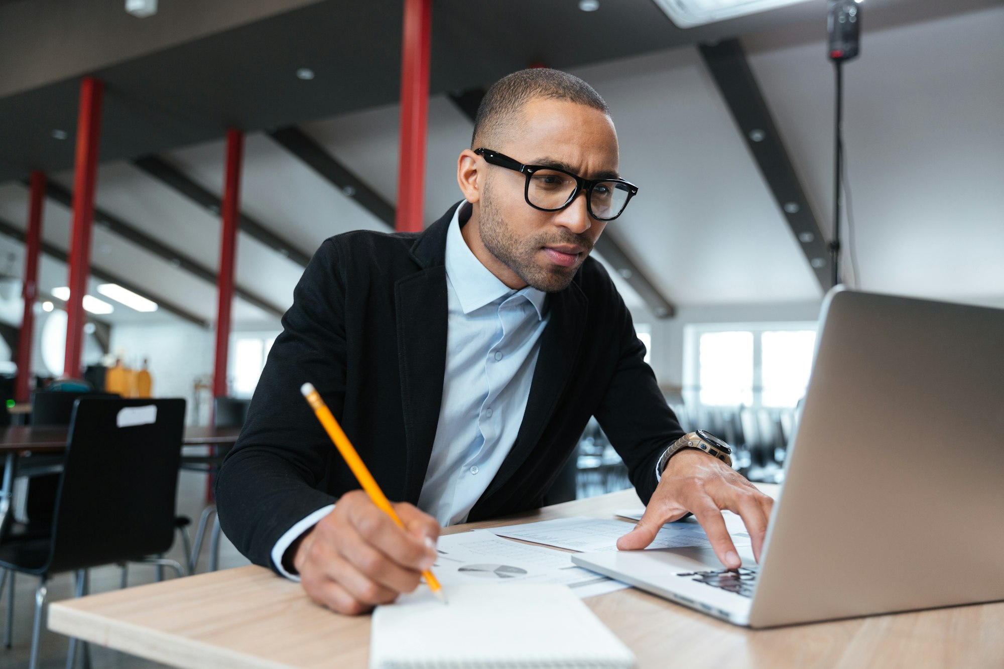 Young employee looking at computer monitor